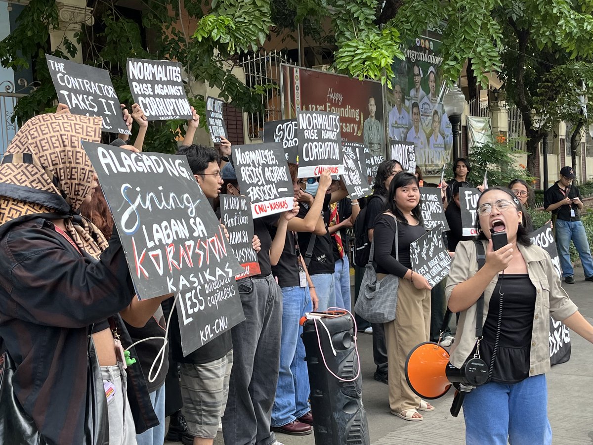 Cebu Normal University students stage a protest this morning, September 21, after the administration removed a Martial Law commemoration banner and attempted to take down a student publication post.
