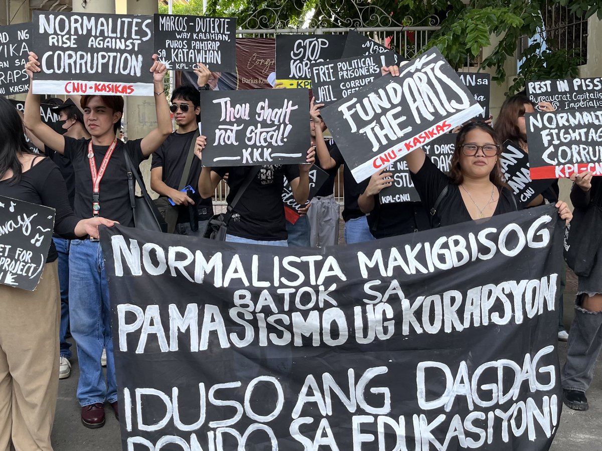 Cebu Normal University students stage a protest this morning, September 21, after the administration removed a Martial Law commemoration banner and attempted to take down a student publication post.  